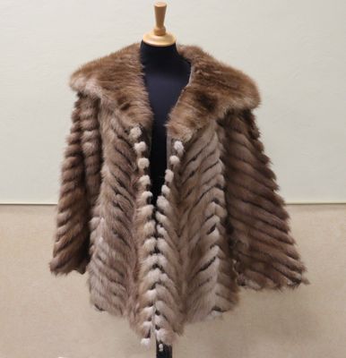 a woman ' s fur coat on a mannequin mannequin mannequin mannequin mannequin mannequin mannequin mannequin
