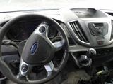 a dashboard of a car with a steering wheel and dashboard controls