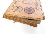 un vieux livre recouvert d'autocollants
