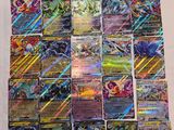 a pile of pokemon cards sitting on top of a table
