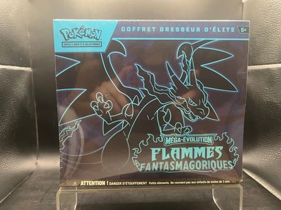 un gros plan sur une boîte de figurines Pokémon posée sur une table