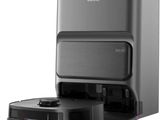 une photo en noir et blanc d'un aspirateur robot et une photo en noir et blanc d'un aspirateur robot