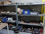 many shelves with various tools on them in a garage