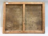an old wooden frame with a window on the inside of it