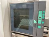 an oven that is sitting in the kitchen with the door open