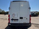 a white van that is parked in a parking lot