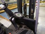 a close up view of a forklift in a warehouse