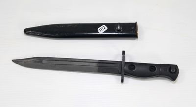 a black knife and a black knife on a white table
