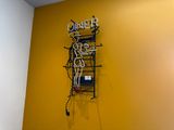 a neon sign that says dinner on the wall
