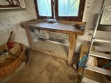 a picture of a room with a table and a ladder