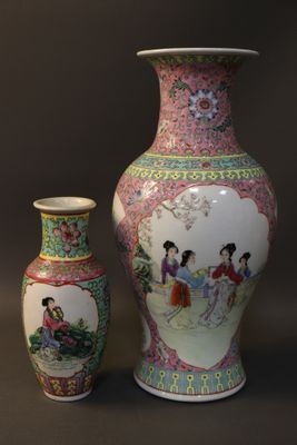 two vases sitting next to each other on a table