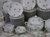 a lot of plates and cups and saucers on the table