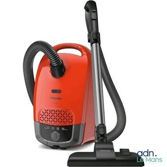 une image représentant un aspirateur rouge muni d'une poignée noire