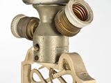a close up of a metal object on a stand