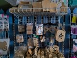 many boxes and bags on a shelf in a store