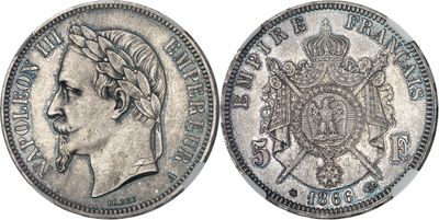 a silver coin with a crown on the front and a crown on the back