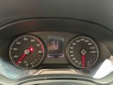 a close up of a car dashboard with various gauges