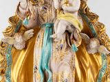 an image of a statue of a woman holding a baby in her arms