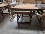 many tables and benches in a building with a skylight