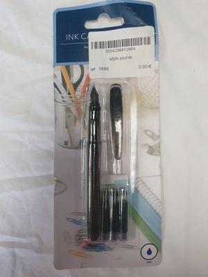 two pens that are in the package on the bed