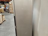a refrigerator that is sitting on a pallet in a warehouse