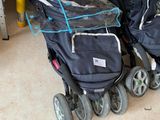two strollers that are sitting next to each other