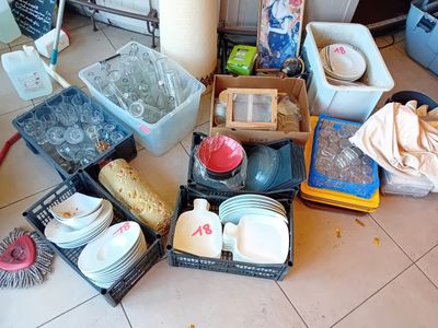 a lot of dirty dishes and dishes on the floor
