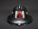 fireman ' s helmet on a black background with a red and white stripe