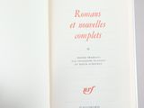 someone is holding a book open to a page with a picture on it