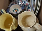 a lot of cups and saucers in a box