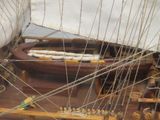a model of a sailboat on display in a museum