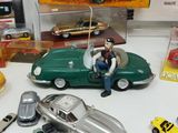 many toy cars and other toys on a table