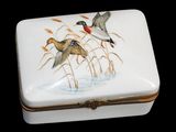 a white box with a painting of two birds on it