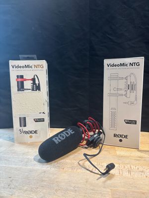 two microphones sitting on a table next to each other