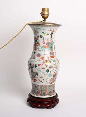 a lamp that is sitting on a wooden stand
