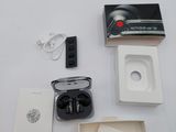 a box of earphones and a charger sitting on a table
