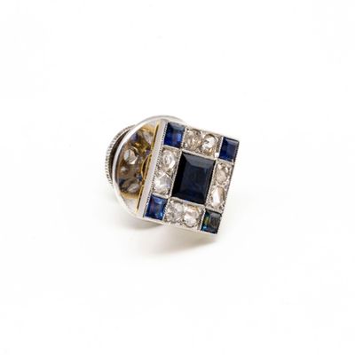 an image of a diamond and sapphire ring on a white background