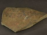 a rock that has been placed on a black surface