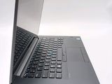 a laptop computer sitting on top of a white table