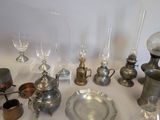 a table with a lot of silver items on it
