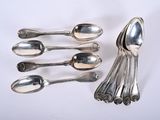 five spoons and six spoons sitting on a table