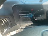 a car dashboard with a digital display on it