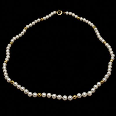 a white pearl necklace with a gold clasp