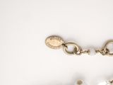 a picture of a necklace and a bracelet on a table