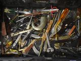 many different types of knives in a black box