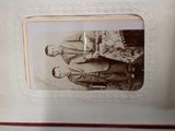 an old photo of a couple of people standing next to each other