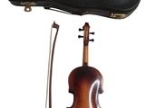a close up of a violin with a case and bow