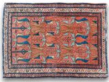 a red rug with a pattern of animals and birds on it