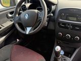 the interior of a small car with a steering wheel and dashboard