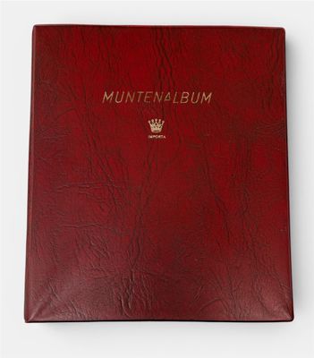 a red book with a gold emblem on the cover